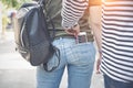 Thief stealing smart phone from back pocket jean on street theft concept Royalty Free Stock Photo