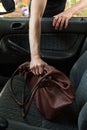 Thief stealing woman's bag from car Royalty Free Stock Photo