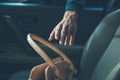 A thief steals bag in car Royalty Free Stock Photo