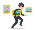 A thief steals a painting from a museum. Royalty Free Stock Photo