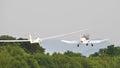 Propeller plane towing a glider in flight Royalty Free Stock Photo