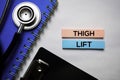 Thigh lift text on top view  on white background. Healthcare/medical concept Royalty Free Stock Photo