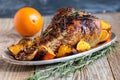 Thigh of turkey baked with oranges.