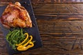 Thigh turkey baked in the oven with spices on black stone board. Healthy food. Thanksgiving dinner Royalty Free Stock Photo