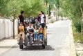 Thiksay Monastery in Thiksey village, India Ã¢â¬â August 20, 2016: Smilling locals tibetan family rides by the lorry and looks in