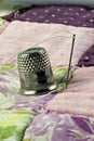 Thimble and patchwork quilt Royalty Free Stock Photo