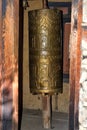 Buddhist prayer wheel close-up in a temple