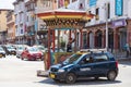 Thimphu, Bhutan - October 26, 2021: Crossroads in Thimphu. Policeman regulates the traffic. A traditional crossing hut in the