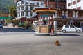 Thimphu, Bhutan - October 26, 2021: Crossroads in Thimphu. Policeman regulates the traffic. Traditional crossing hut to protect