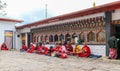 Thimphu, Bhutan - September 15, 2016: Bhutanese monks sitting in the backyard of Simtokha Dzong, Thimphu, Bhutan