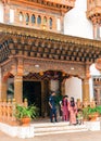 Thimphu, Bhutan - September 10, 2016: Bhutanese Royal palace guard with local women standing at the building entrance.