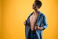 Thin African American teen shows bare torso. Royalty Free Stock Photo