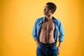 Thin African American teen shows bare torso. Royalty Free Stock Photo