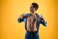 Thin African American teen shows bare torso. Royalty Free Stock Photo