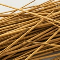 Thin bamboo sticks scattered across a surface. The sticks are cylindrical, elongated, Royalty Free Stock Photo