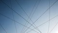 Abstract composition of thin black wires intersecting against a clear gradient blue sky background Royalty Free Stock Photo