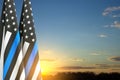 Thin Blue Line. American flag with police blue line on a background of sunset Royalty Free Stock Photo