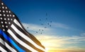 Thin Blue Line. American flag with police blue line on a background of sunset. Support of police and law enforcemen Royalty Free Stock Photo