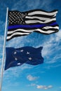 thin blue line flag of US with smaller flag of Naval jack of the Confederate states of America state, Usa at cloudy sky background