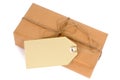 Thin brown paper package with string and manila label isolated, copy space Royalty Free Stock Photo