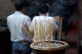 Thin candles with incense on a special stand