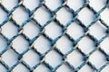 Thin chain wire fence, seamless pattern on white background, flat lay view Royalty Free Stock Photo