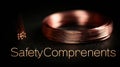 Thin Copper Thermocouple Wire Coiled on Dark Plate With Wide Space for Safety Components Text Royalty Free Stock Photo