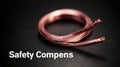 Copper Thermocouple Wire Coiled on a Dark Metallic Plate With Text for Safety Components in the Background Royalty Free Stock Photo