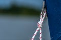 A thin cord tied to a metal handle Royalty Free Stock Photo