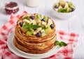 Thin crepe pancakes with fruits and berries. Crepe week.