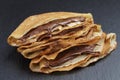 Thin crepes or blinis with chocolate cream