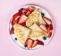 Pancakes on a pink background, top view, close-up, flatlay Royalty Free Stock Photo