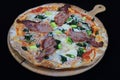 Thin crust Florentine pizza with bacon and spinach