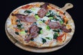 Thin crust Florentine pizza with bacon and spinach