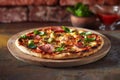 Thin crust pizza with ham, cheese and olive Royalty Free Stock Photo