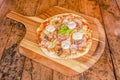Thin crust pizza with lots of red onion, slices of goat cheese, thin slices Royalty Free Stock Photo