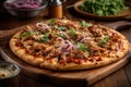 A thin crust pizza topped with tender pulled pork, red onions, and mozzarella cheese. The pizza is baked to perfection and served