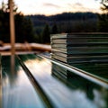 Thin documents on a green outdoor table, generative ai Royalty Free Stock Photo