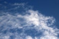 Thin fluffy white clouds in a blue sky on sunny day Royalty Free Stock Photo