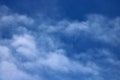 Thin fluffy wispy white clouds in a blue sky Royalty Free Stock Photo