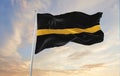 Thin Gold Line flag waving at cloudy sky background on sunset, panoramic view. Dispatchers, Loss Prevention Personnel, Tow Truck Royalty Free Stock Photo