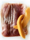 Thin Italian raw ham slices and fresh melon. Royalty Free Stock Photo