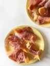Thin Italian raw ham slices and fresh melon. Royalty Free Stock Photo