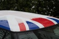 A thin layer of snow and large drops of water lie on the roof of the car, winter, background Royalty Free Stock Photo