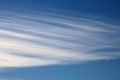 Thin lines of high altitude wispy white clouds Royalty Free Stock Photo