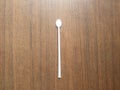 Thin long plastic stirring spoon