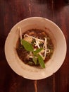 Thin noodle soup, meatballs with fresh bean sprouts and basil