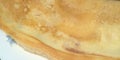 A thin pancake is on the plate. Closeup. Breakfast