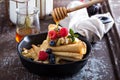 Thin pancakes with apples and fresh berry Royalty Free Stock Photo