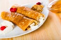 Bulgarian thin pancakes with brynza on white plate Royalty Free Stock Photo